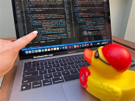 What is the role of the driver in pair programming, and how does it intertwine with the concept of a rubber duck debugging session?